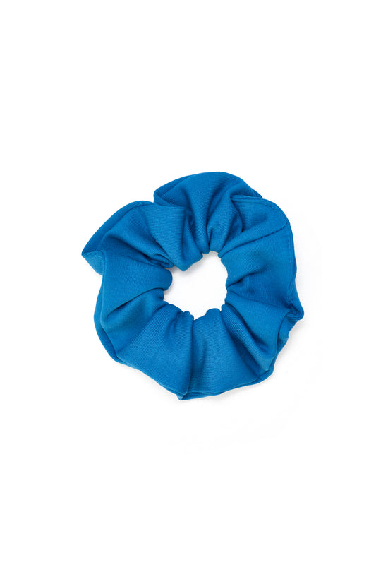Zero waste blue scrunchie crafted from biodegradable, Cradle to Cradle Certified® fabric by Wellicious – a sustainable and non-toxic hair accessory designed for zero-waste, eco-conscious living.